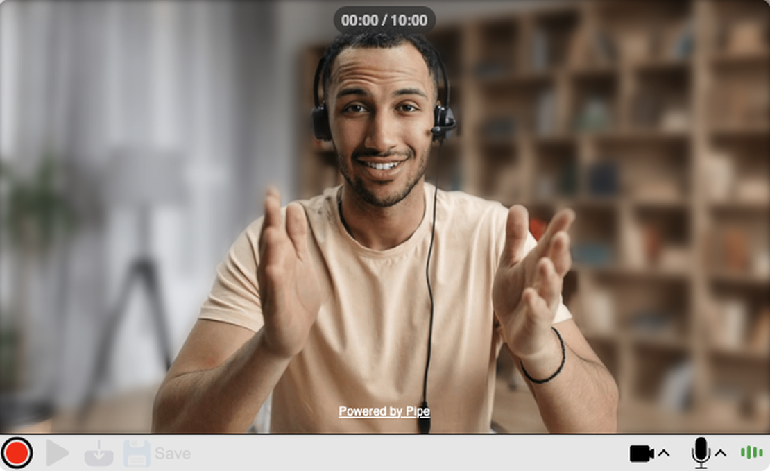 A man is recording himself using addpipe's recording client, while the real time background blurring feature is turned on